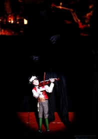 Dueling Violins-  Phillip Performs while the Honolulu Symphony Orchestra's Violinist plays for him. Union rules prevent taped music. Everything must be live.  